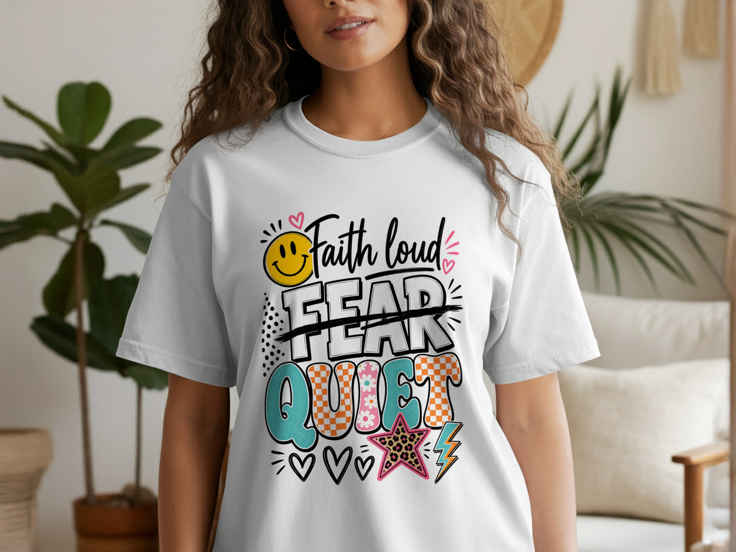 White t-shirt with colorful "Faith loud, Fear quiet" graphic and smiley face.
