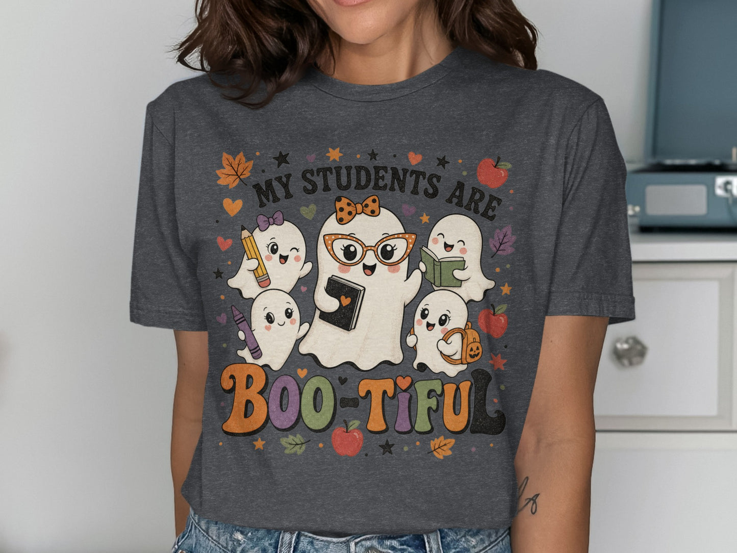 "My Students Are Boo-Tiful" text with cartoon ghosts and school supplies.