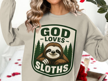 Cream sweatshirt with "God Loves Sloths" graphic and sloth illustration.
