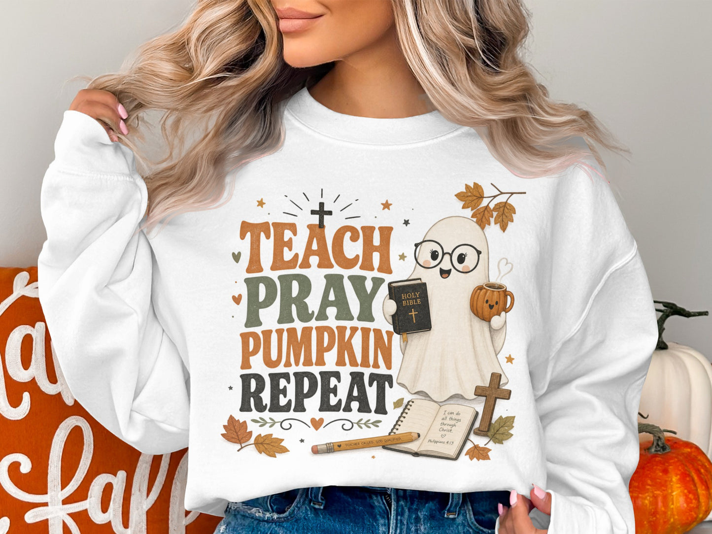 Sweatshirt with ghost reading Bible and "Teach Pray Pumpkin Repeat" text.
