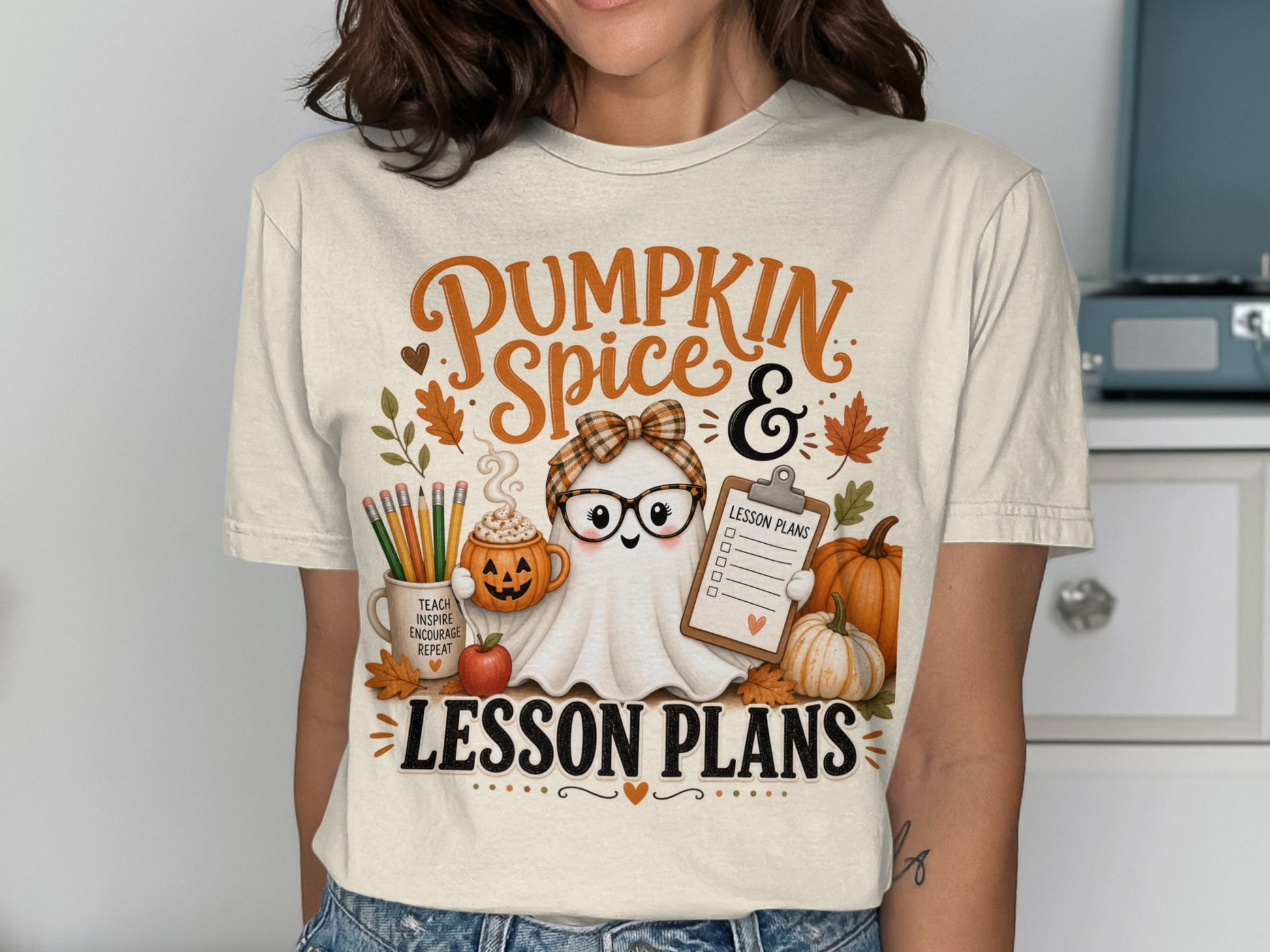 Ghost with glasses and pumpkin spice, teaching and lesson plans on shirt.