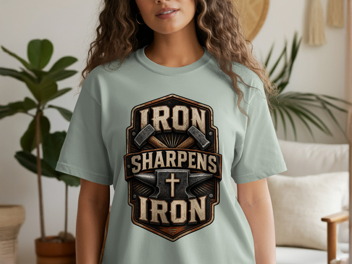 Light blue t-shirt with "IRON SHARPENS IRON" text and anvil graphic.