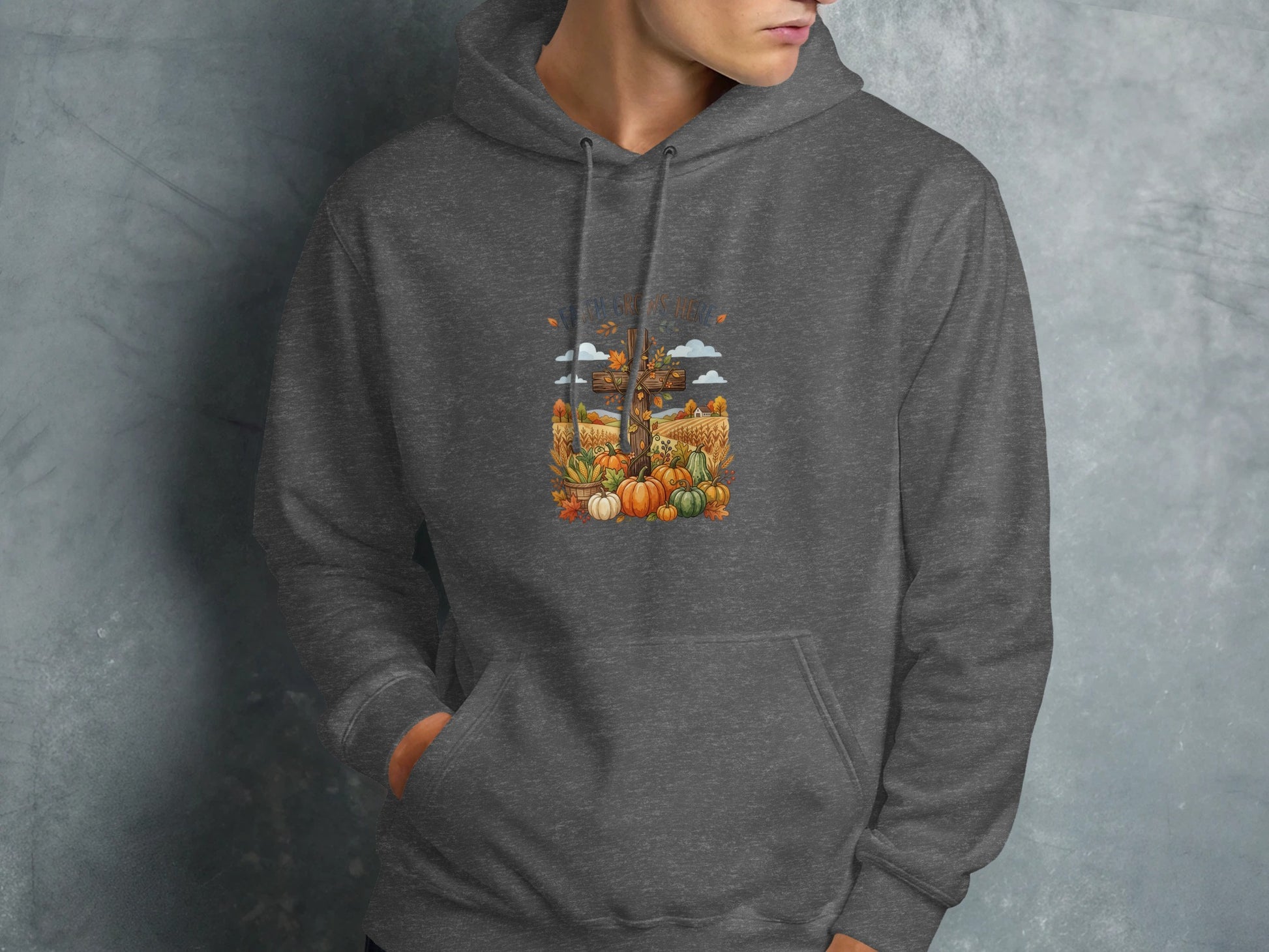 Dark gray hoodie with a fall harvest graphic featuring pumpkins and corn stalks.