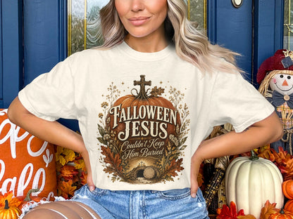 White t-shirt with "Halloween Jesus Couldn't Keep Him Buried" graphic.