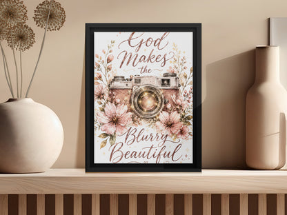 Framed print with vintage camera, flowers, and "God Makes the Blurry Beautiful" text.