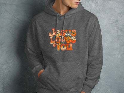 Dark gray hoodie with "Jesus Loves You" graphic in colorful retro font.