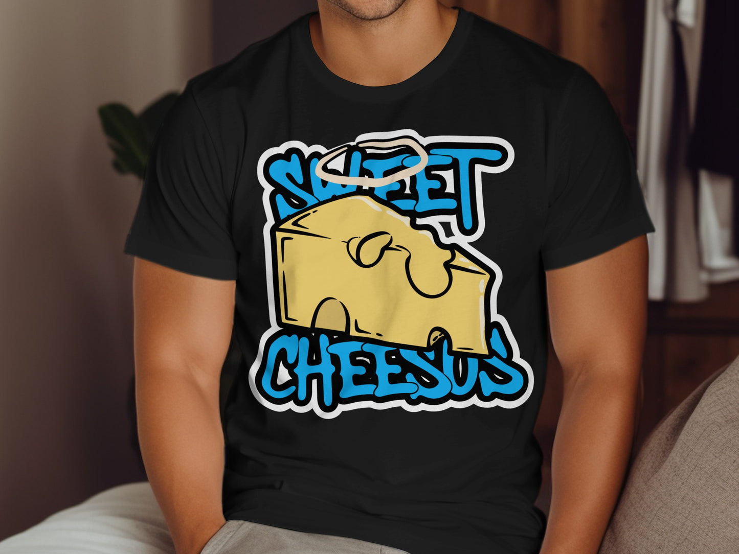 Black t-shirt with yellow cheese graphic and "Sweet Cheesus" text.