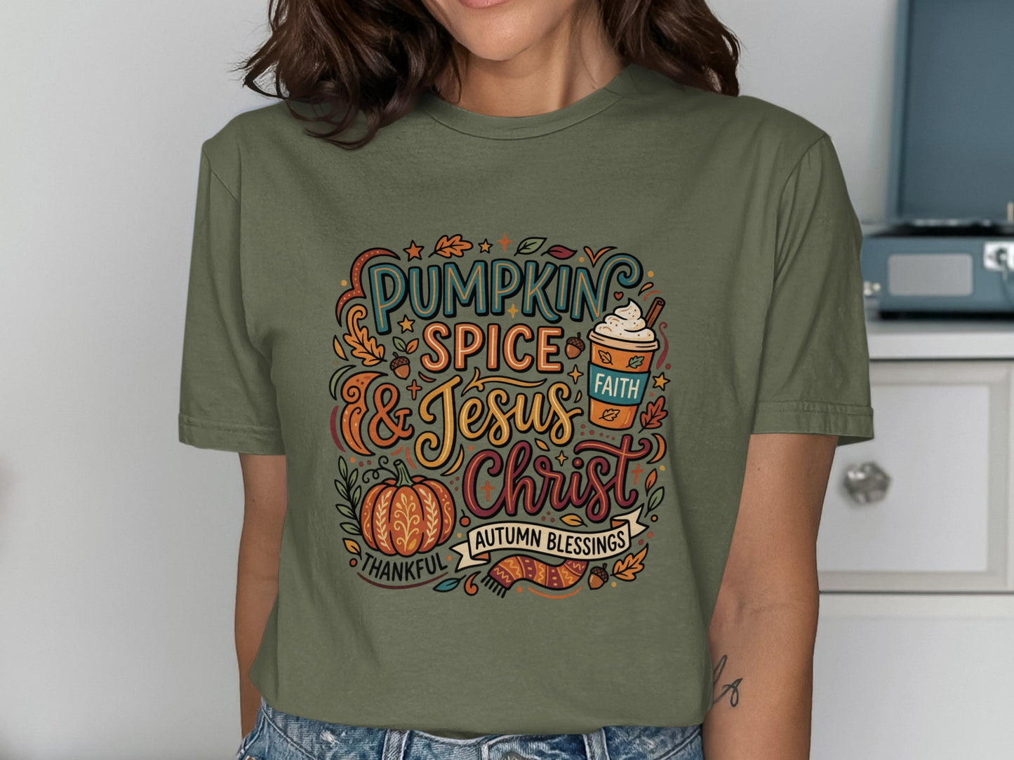 Green t-shirt with "Pumpkin Spice & Jesus" autumn blessings graphic.