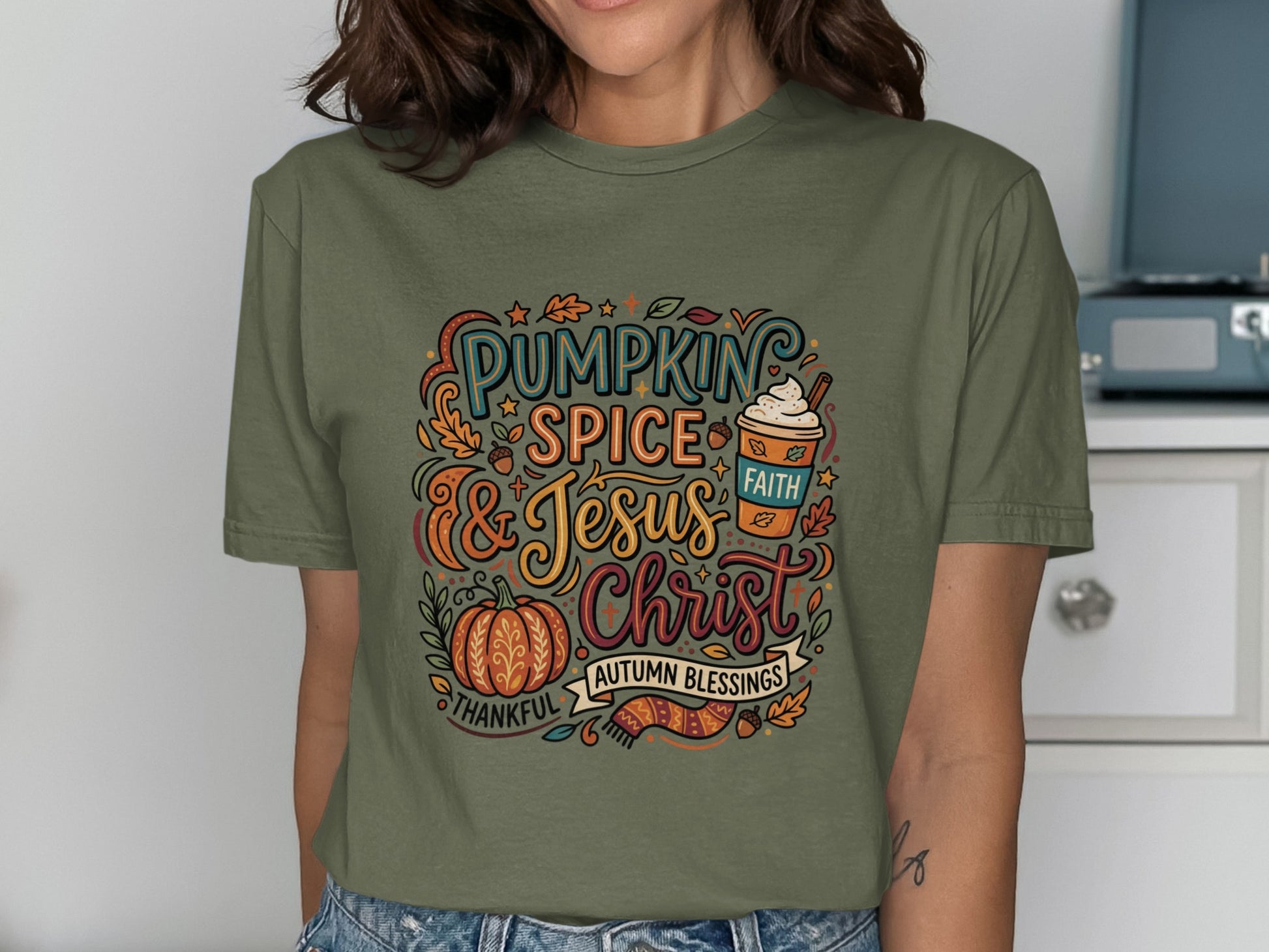 Green t-shirt with "Pumpkin Spice & Jesus" autumn blessings graphic.