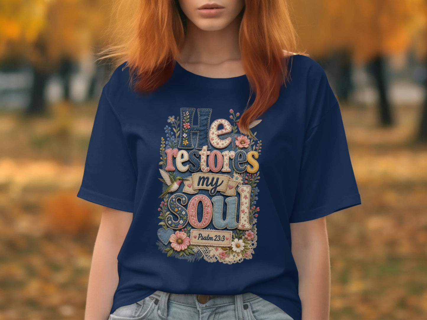 Navy t-shirt with "He restores my Soul" and Psalm 23:3 floral text.