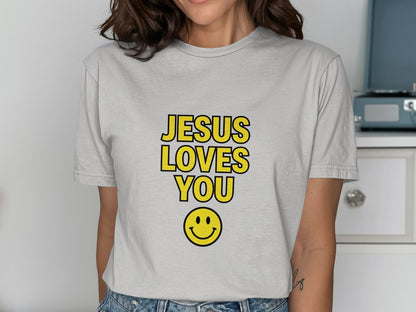 Light gray t-shirt with "JESUS LOVES YOU" and smiley face.