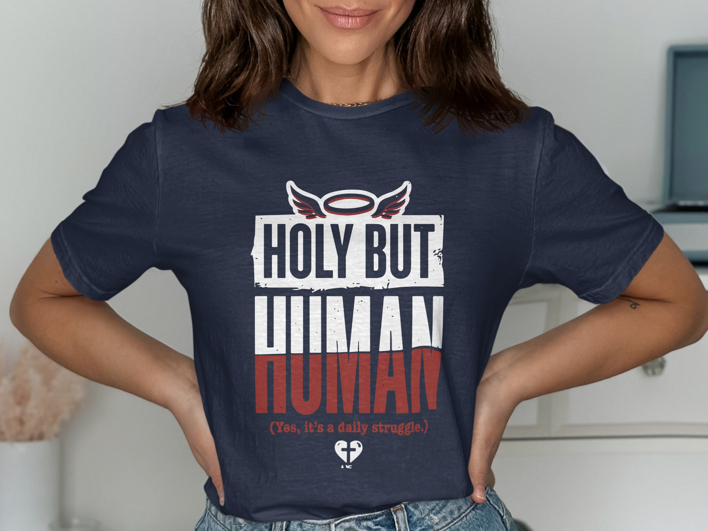 Navy t-shirt with "Holy but Human" and "Yes, it's a daily struggle" text.