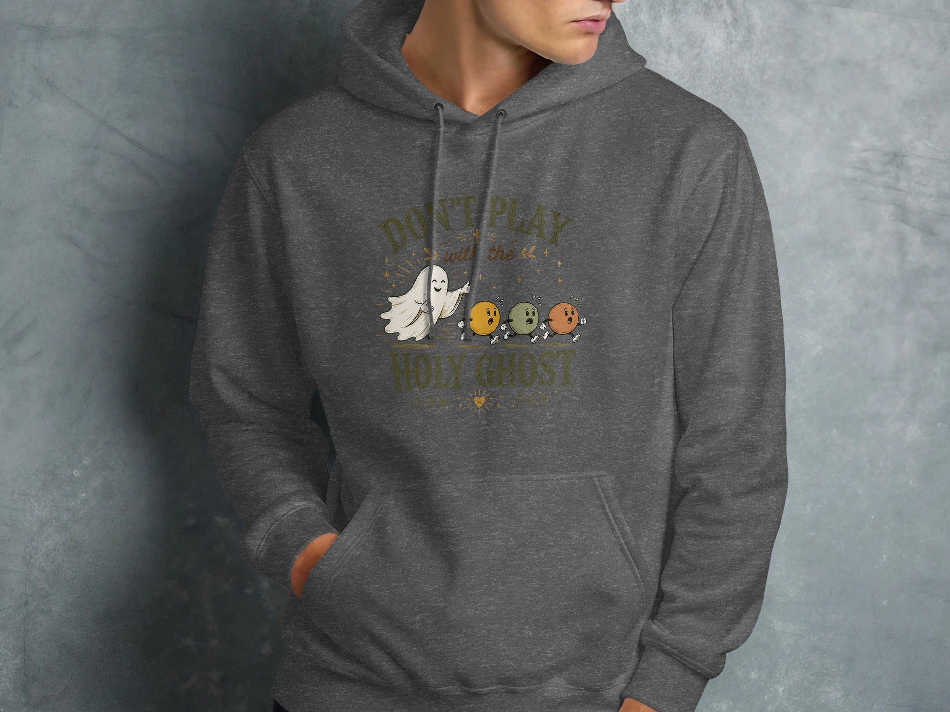 Dark grey hoodie with ghost and balls graphic and text "DON'T PLAY WITH THE HOLY GHOST".