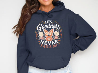 Navy hoodie with floral circular design and "His Goodness Never Fails Me" text.