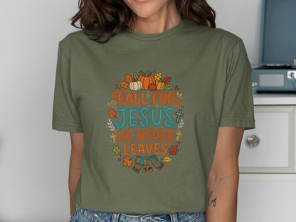 Olive green t-shirt with "Fall for Jesus, He Never Leaves" text and autumn graphics.