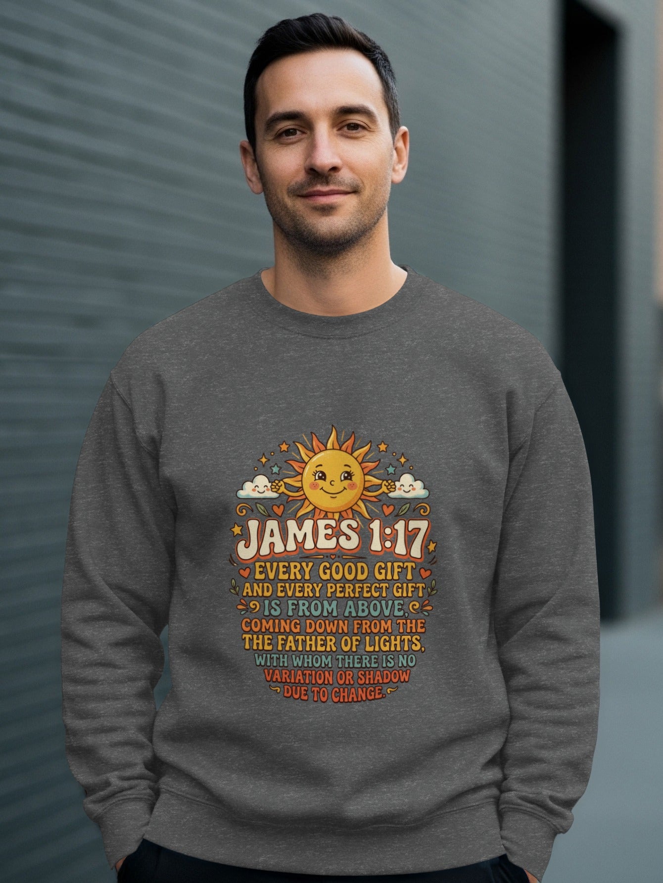 Man wearing a gray sweatshirt with James 1:17 Bible verse and sun graphic.
