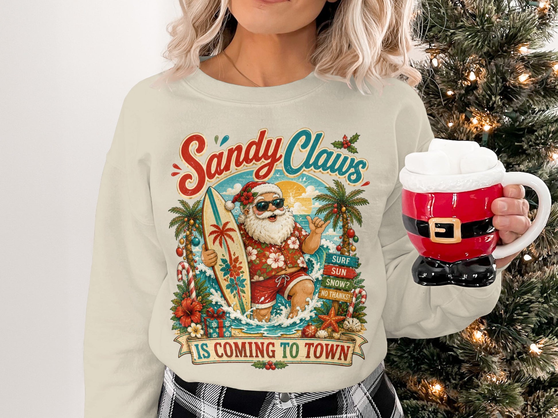 Sandy Claws graphic with Santa on surfboard, tropical background, mug shaped like Santa's suit.