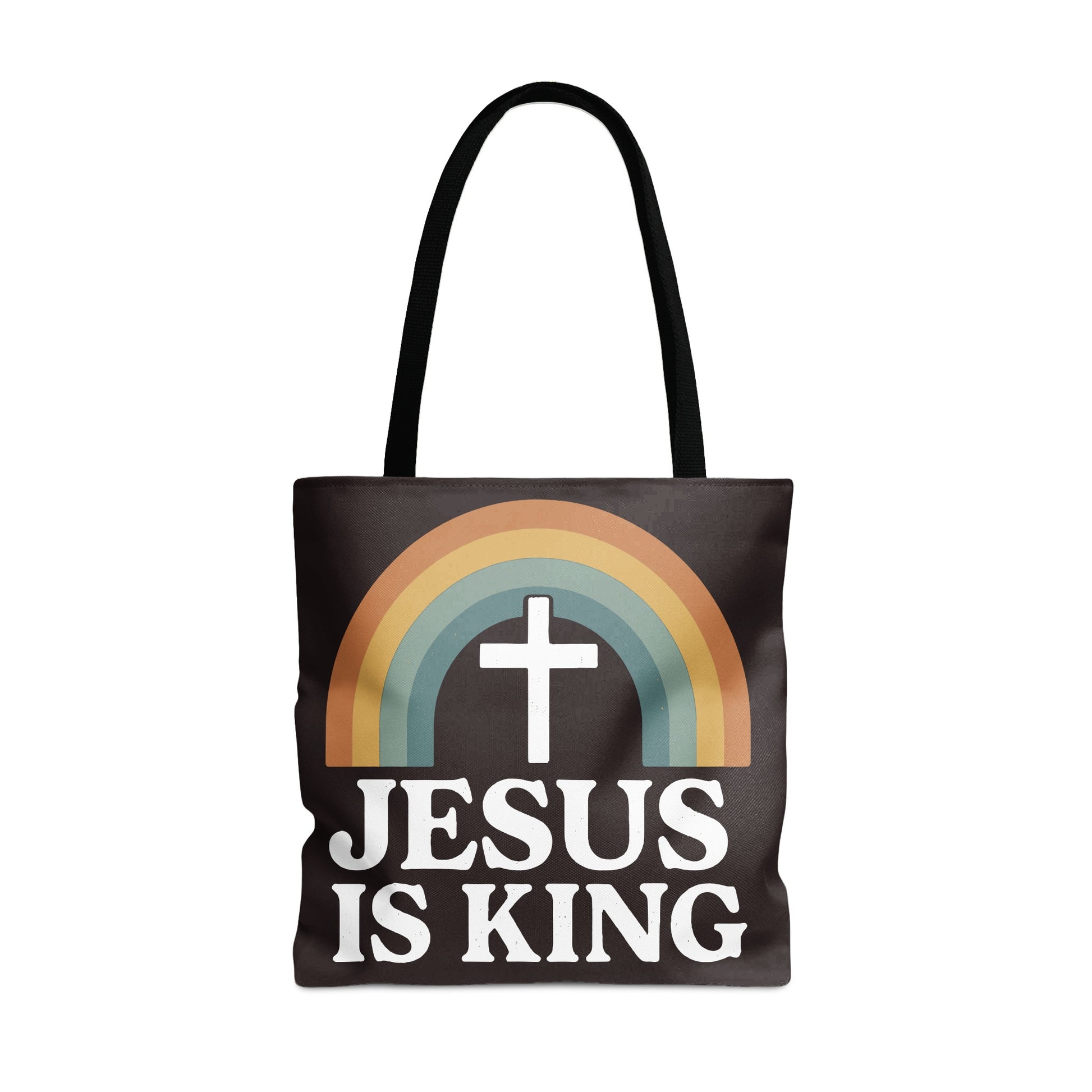 Black tote bag with white text "JESUS IS KING" and a cross inside a rainbow.