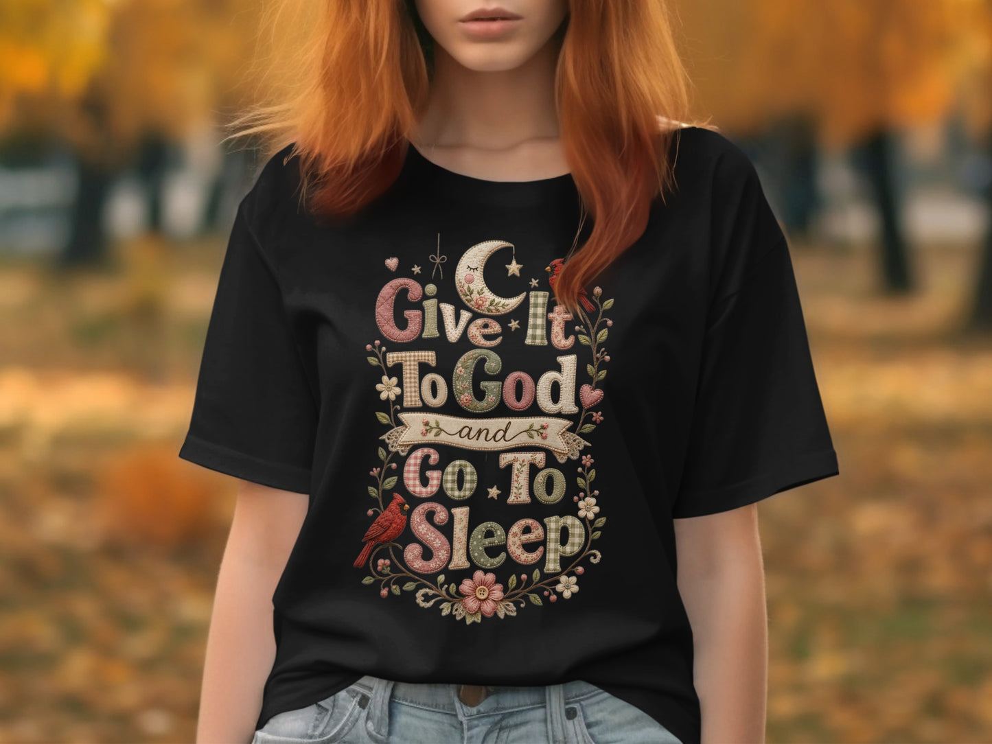 Black t-shirt with "Give it to God and go to sleep" text and floral design.