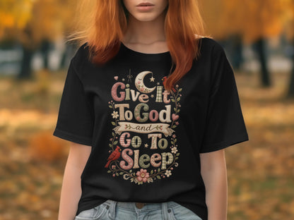 Black t-shirt with "Give it to God and go to sleep" text and floral design.