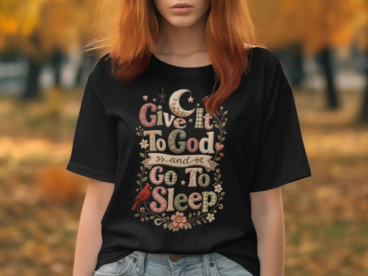 Black t-shirt with "Give it to God and go to sleep" text and floral design.