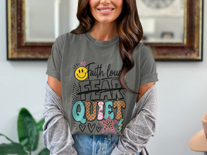 "Faith over fear" graphic on gray t-shirt with smiley face and bold lettering.