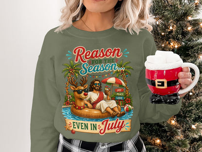 Woman wearing Christmas sweatshirt with "Reason for the Season" and Jesus on an inner tube.
