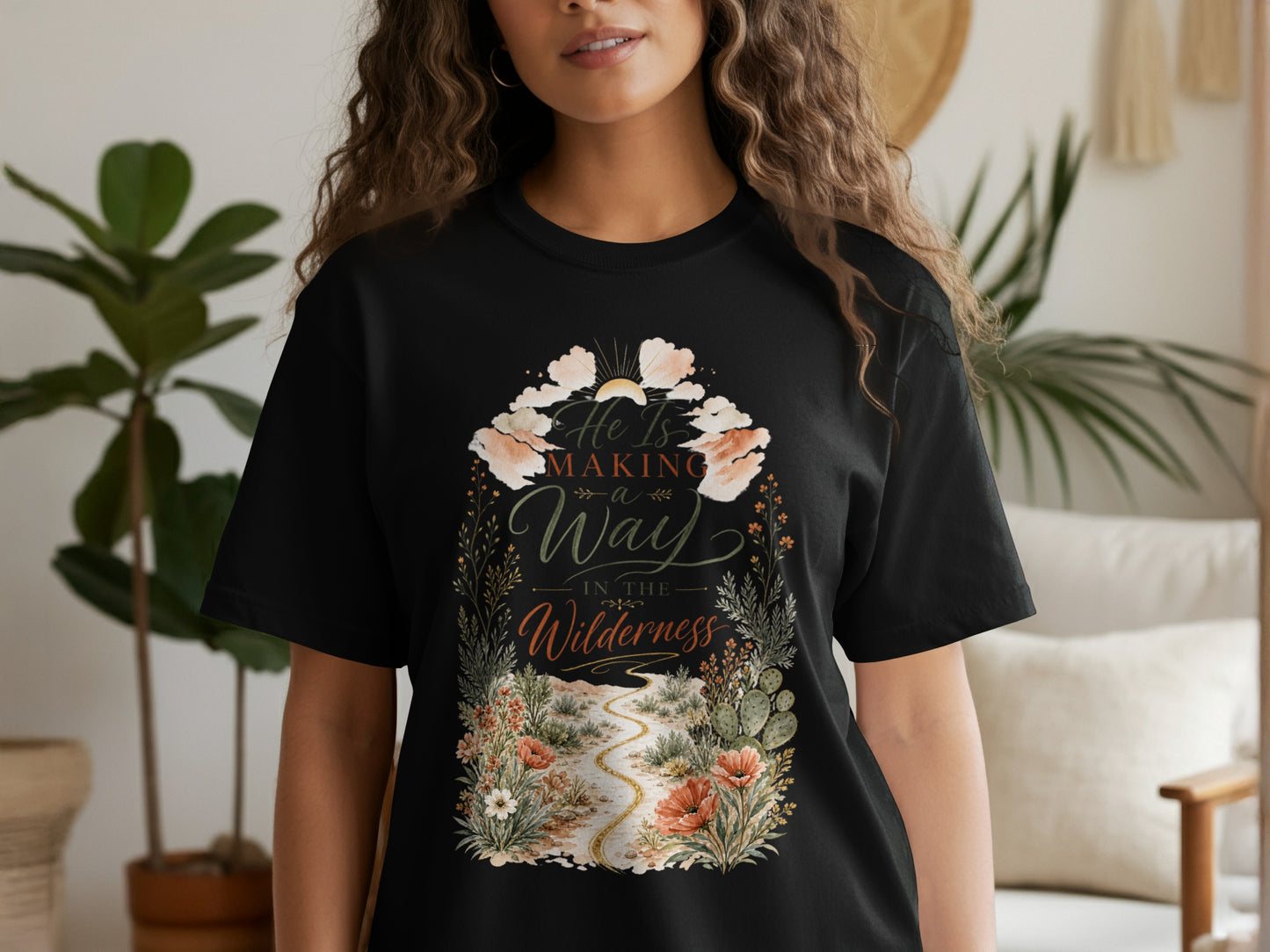 Black t-shirt with design: He Is Making a Way in the Wilderness.