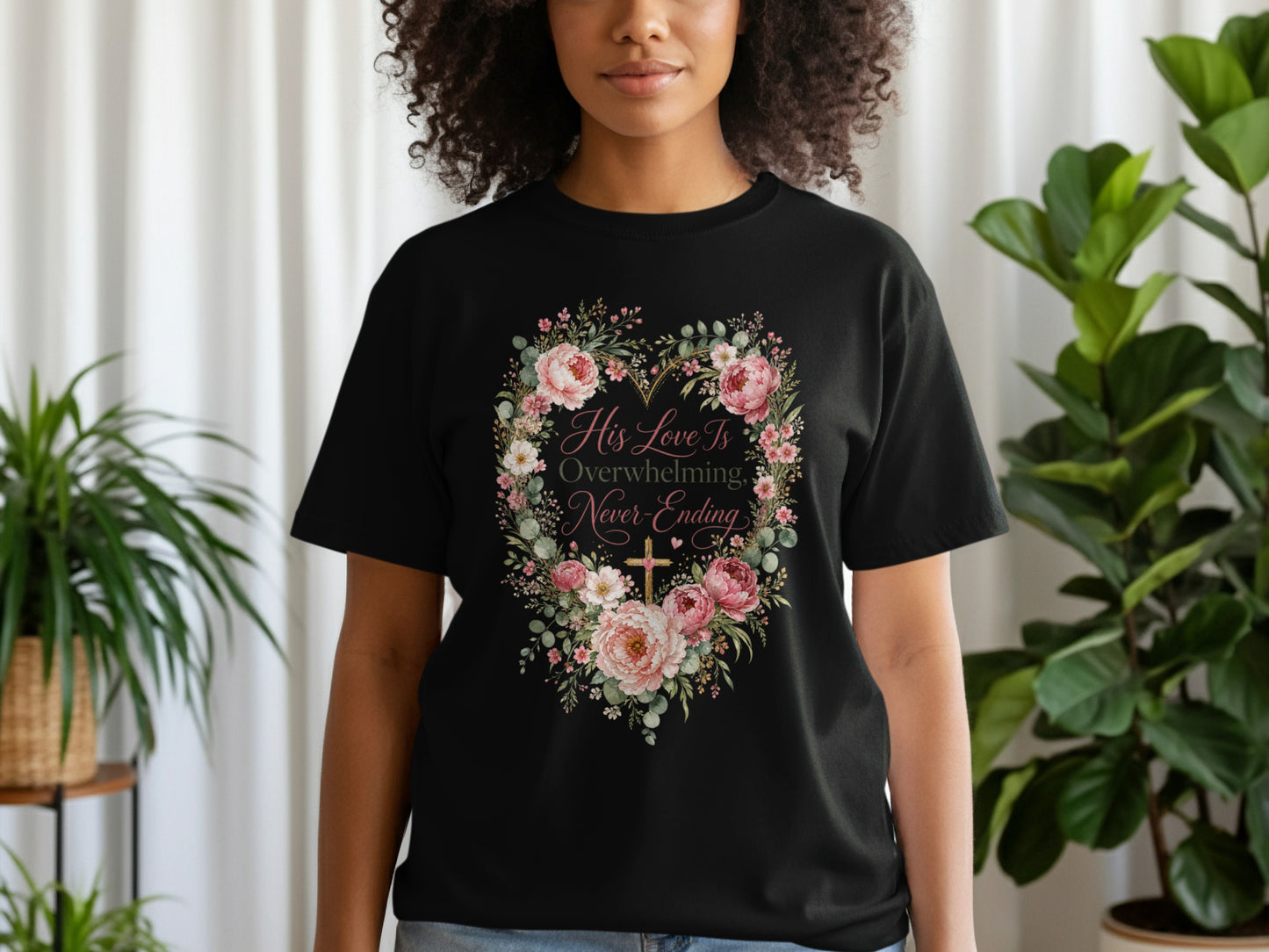 Black t-shirt with floral heart design and text "His Love Is Overwhelming, Never-Ending".