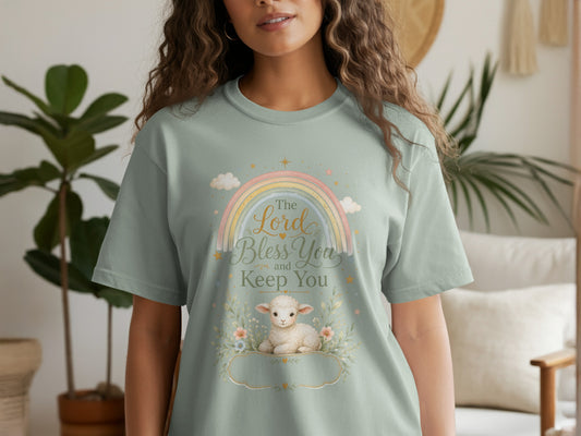 T-shirt with a watercolor design of a lamb, rainbow, and text "The Lord Bless You and Keep You."