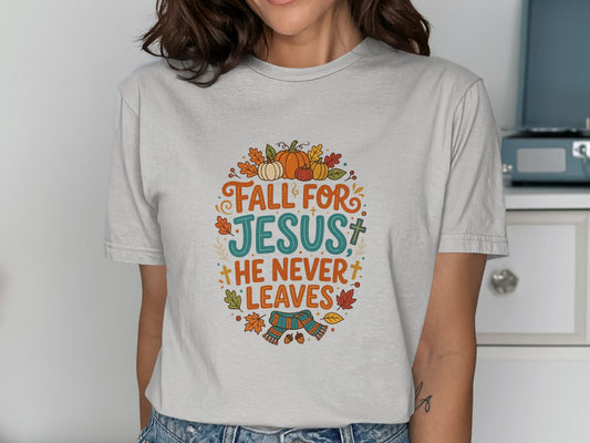 "Fall for Jesus, he never leaves" text with autumn leaves and pumpkins graphic.