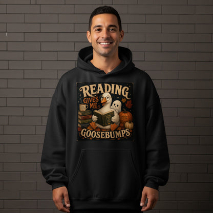 Duck reading a book with ghosts and pumpkins, "Reading Gives Me Goosebumps."