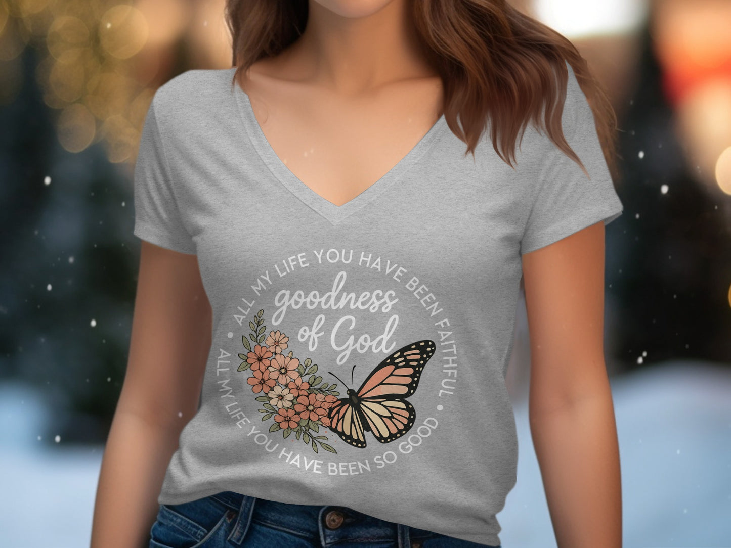 Grey v-neck t-shirt with floral butterfly graphic and text "goodness of God".