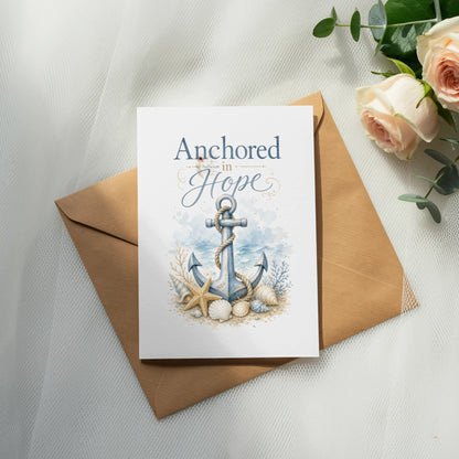 Card with anchor, shells, and text "Anchored in Hope" on envelope.