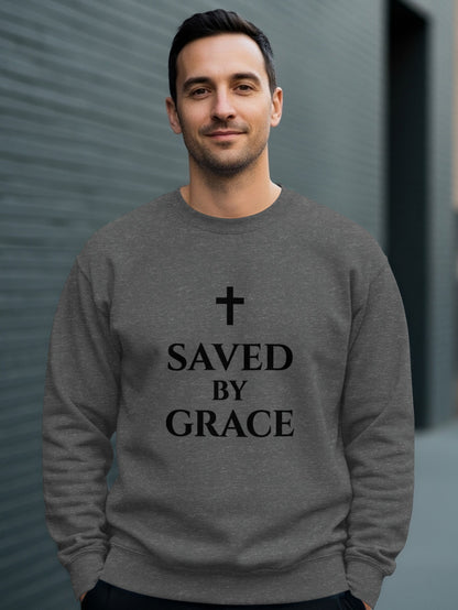 Man wearing a dark grey sweatshirt with a cross and "Saved by Grace" text.