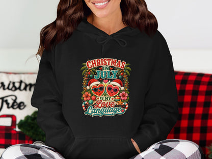 Black hoodie with "Christmas in July is my Love Language" text and heart fruit design.