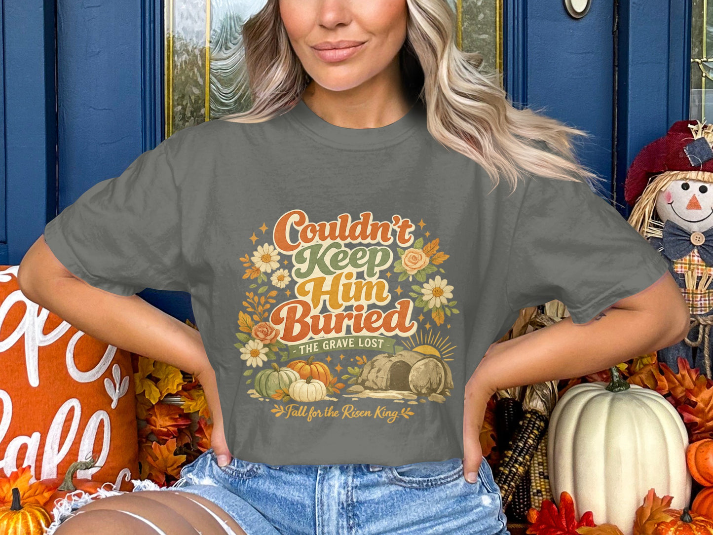 Gray t-shirt with "Couldn't Keep Him Buried" text and Easter graphic.