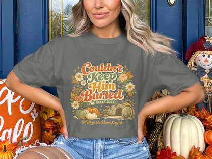 Gray t-shirt with "Couldn't Keep Him Buried" text and Easter graphic.
