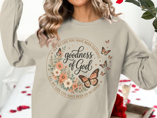 Crewneck sweatshirt with floral wreath, butterflies, and text "Goodness of God".