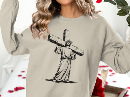 Jesus wearing a crown of thorns carries a wooden cross on his shoulder.