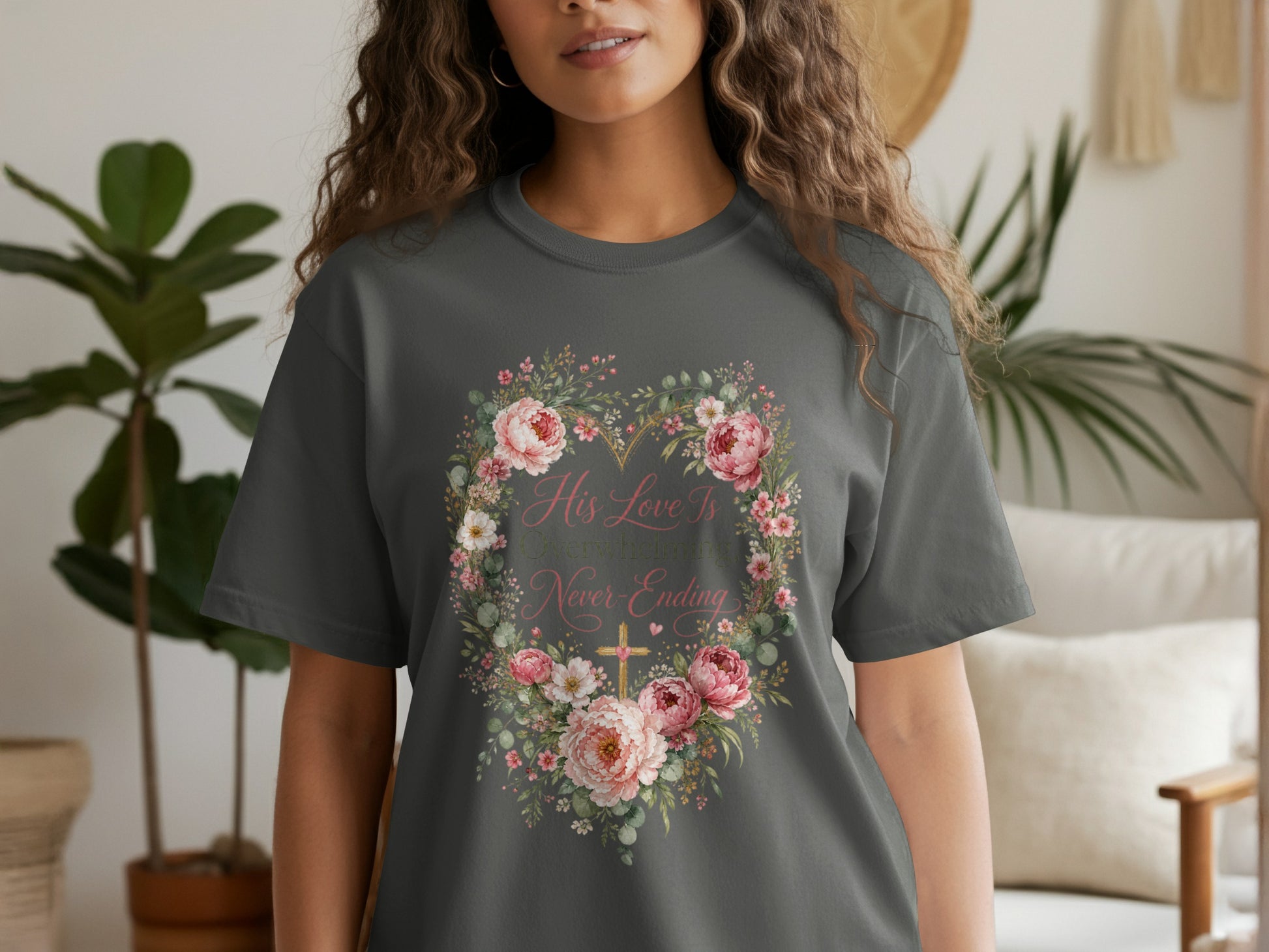 Dark gray t-shirt with floral heart graphic and text "His love is overwhelming and never-ending."