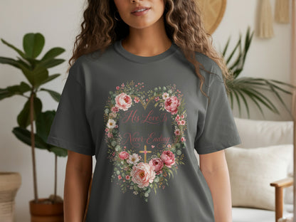 Dark gray t-shirt with floral heart graphic and text "His love is overwhelming and never-ending."