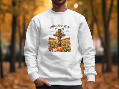 White sweatshirt with "Faith Grows Here" and autumn harvest graphic.