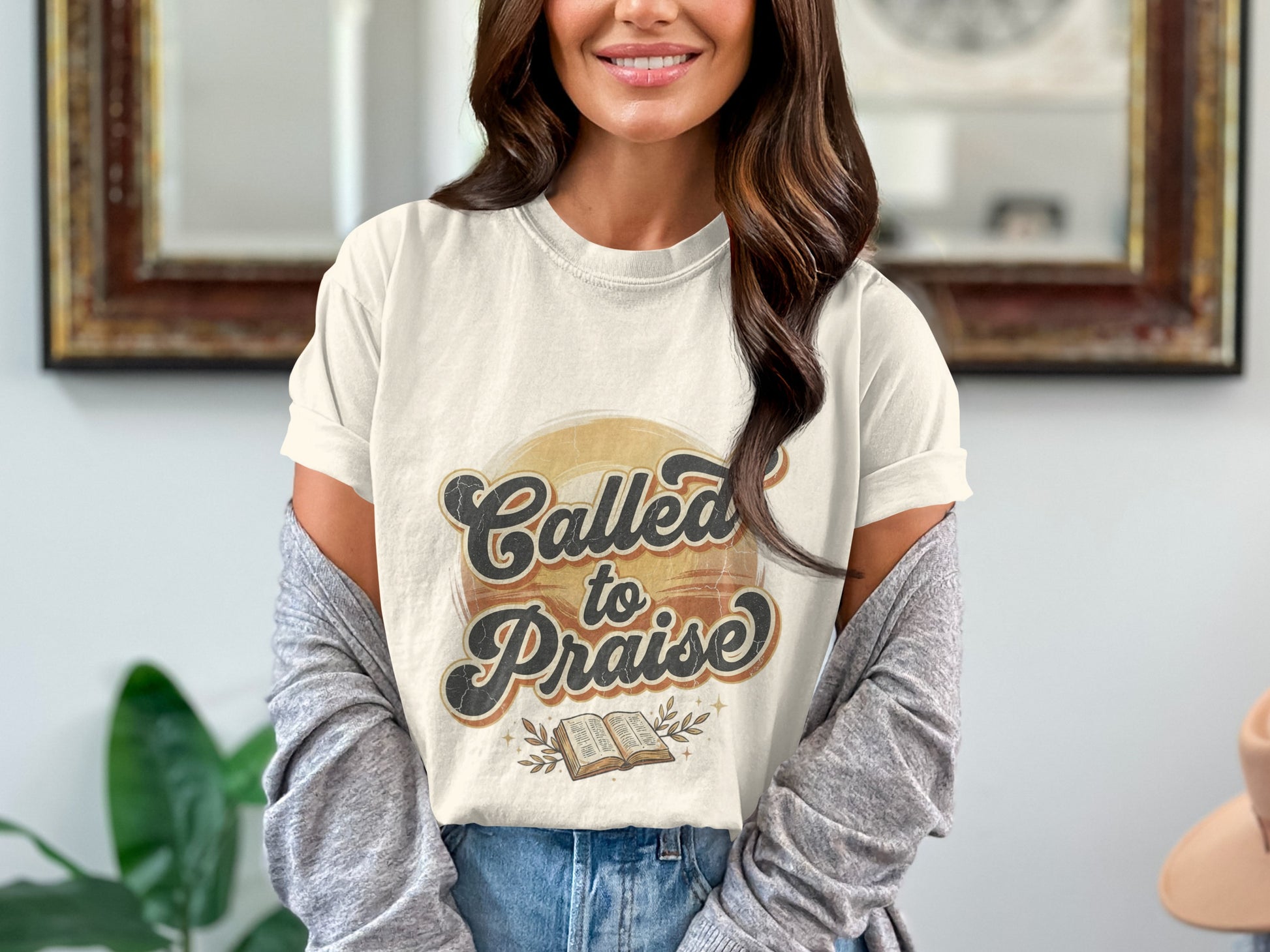 Cream t-shirt with "Called to Praise" text, open Bible, and leafy branches graphic.
