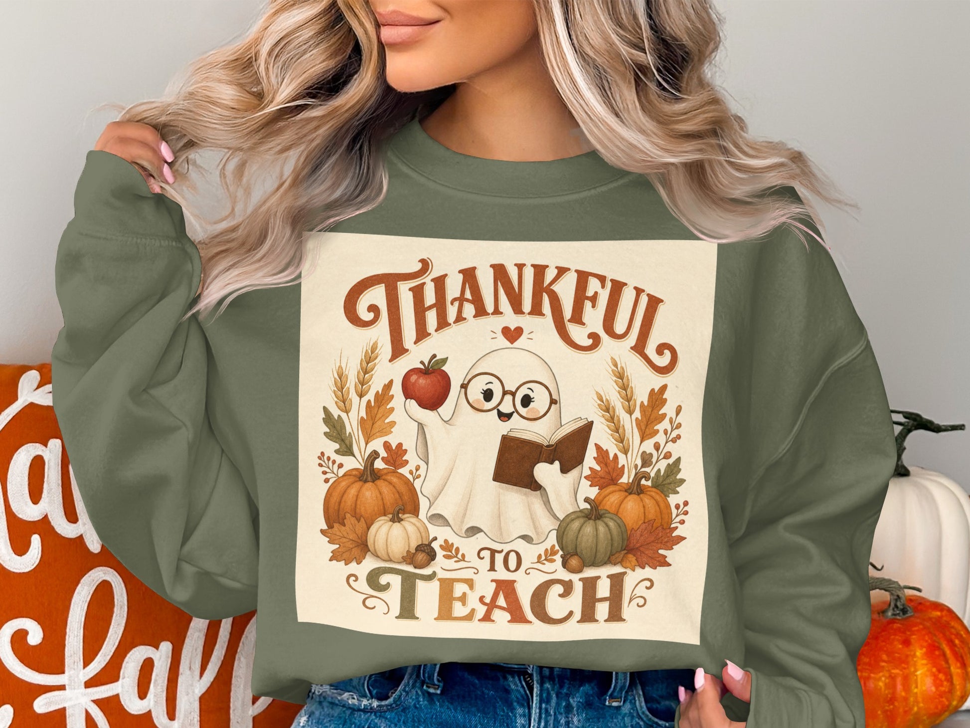 "Thankful to Teach" graphic with a ghost, apple, book, pumpkins, and fall leaves.