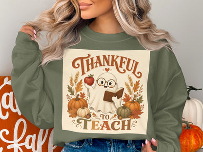 "Thankful to Teach" graphic with a ghost, apple, book, pumpkins, and fall leaves.