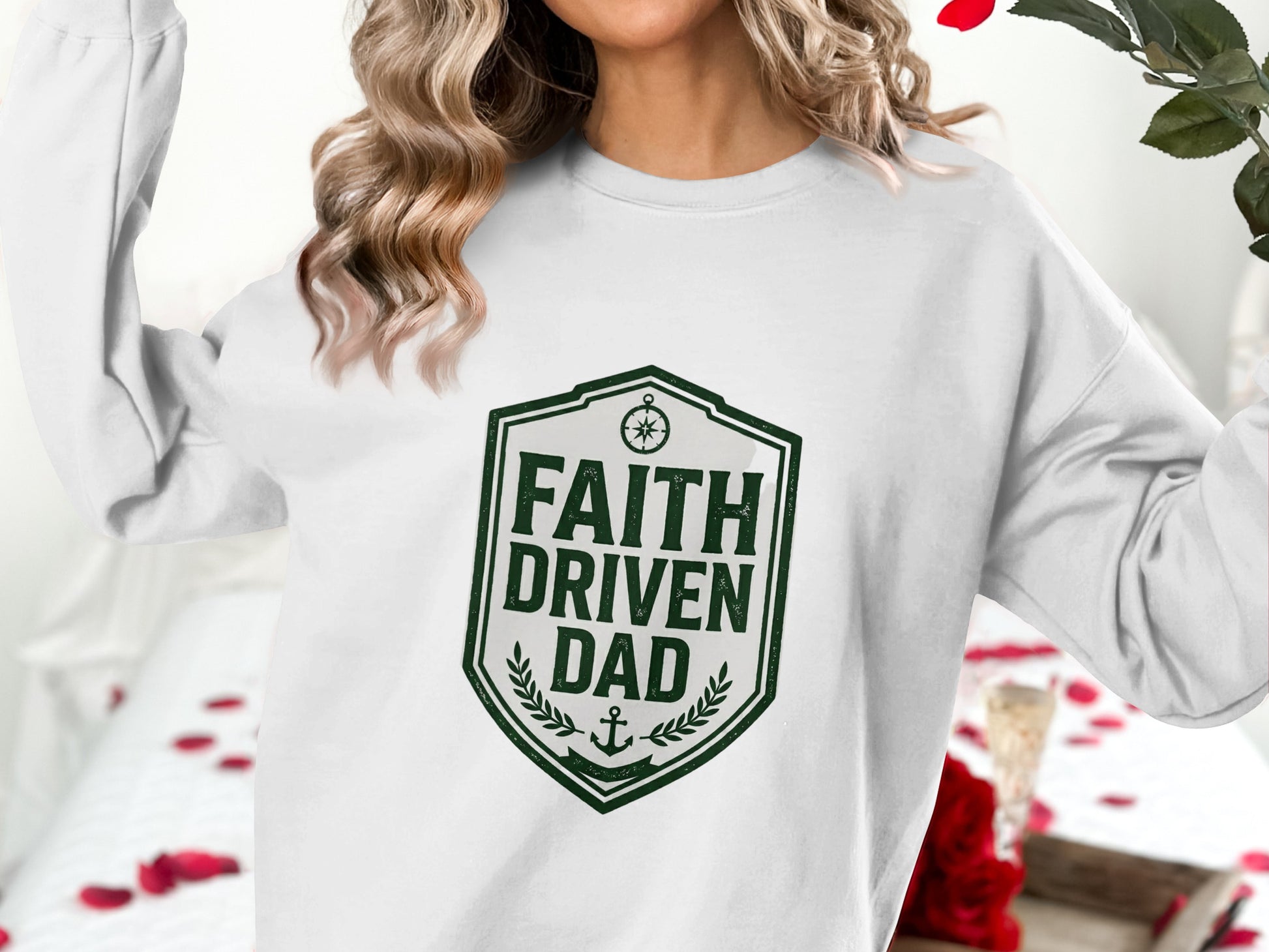 Green shield logo with "FAITH DRIVEN DAD" text on white sweatshirt.