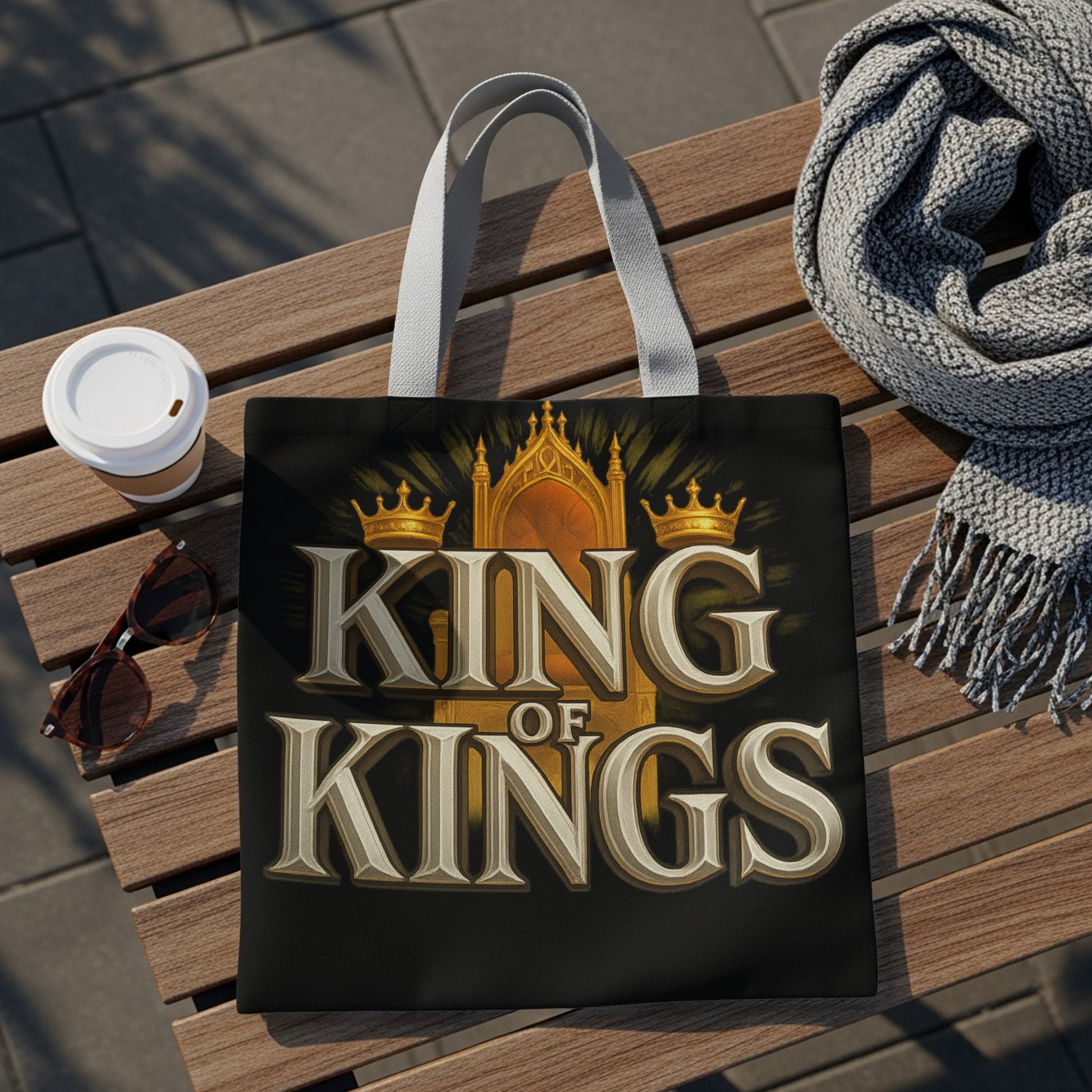 Tote bag with "KING OF KINGS" text and crown design on black background.