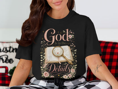 Black t-shirt featuring "God Is in the Details" with an open Bible and magnifying glass.