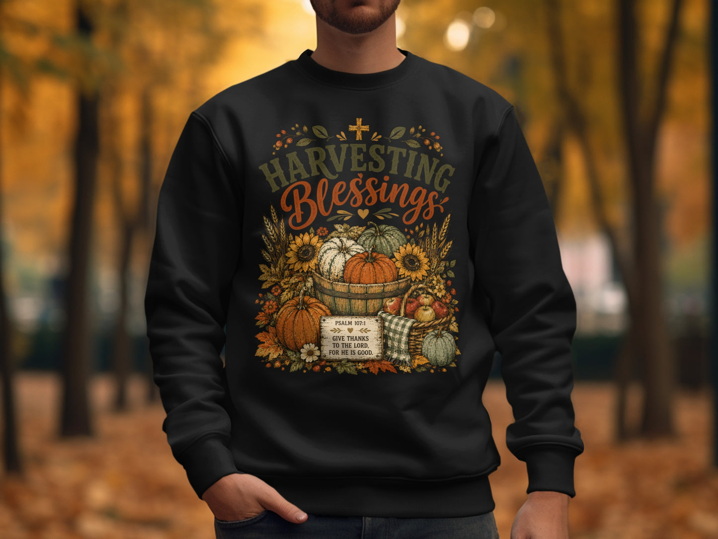 Sweatshirt with "Harvesting Blessings" text and autumn harvest illustration.